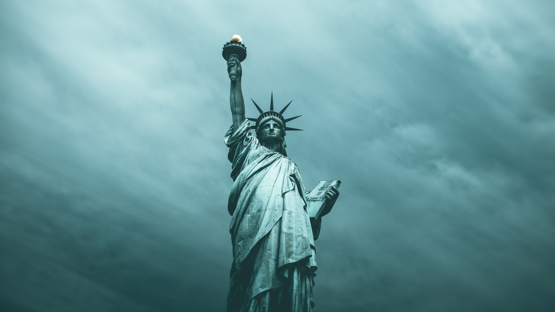 Low Angle View Of Statue Against Cloudy Sky